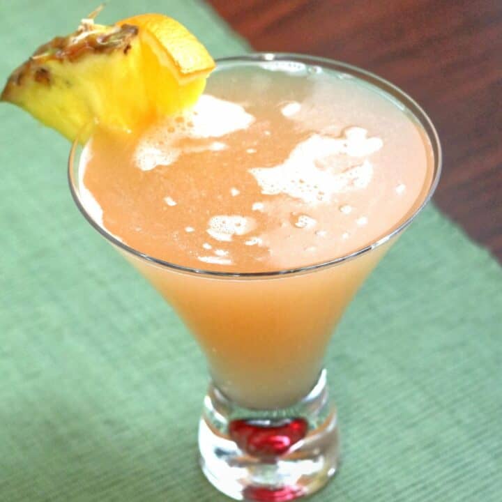 57 Chevy drink with pineapple and orange garnish