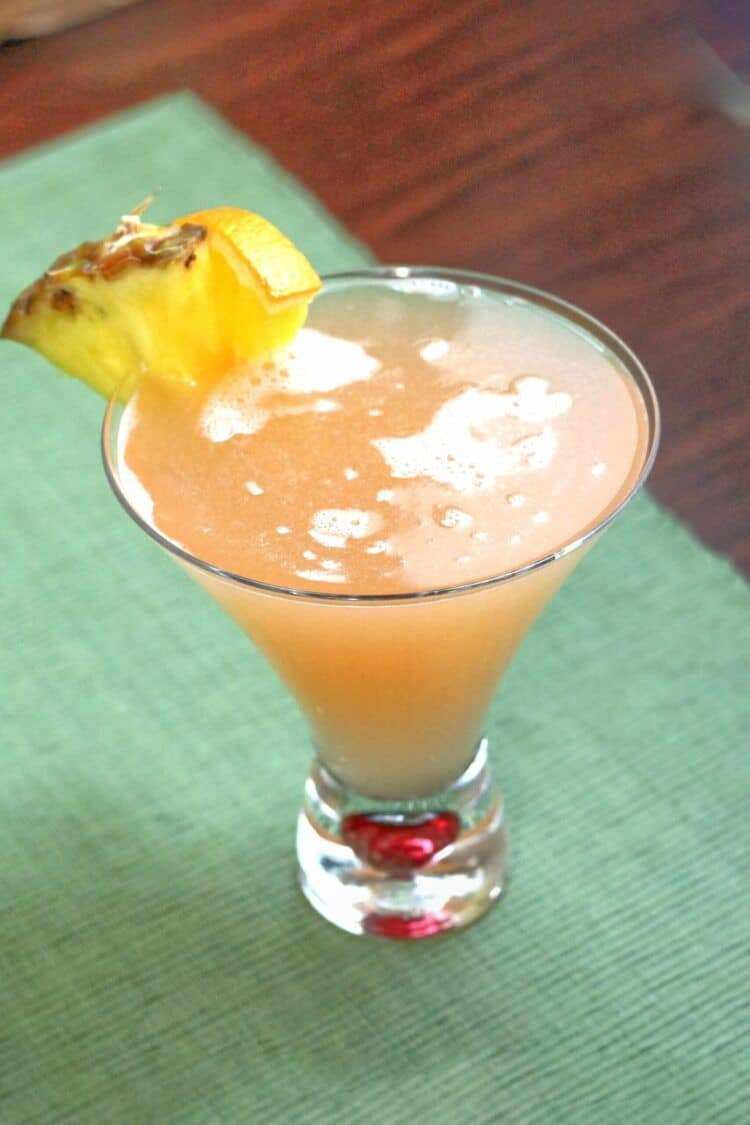 57 Chevy drink with pineapple and orange garnish