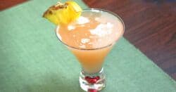 57 Chevy drink with pineapple and orange garnish