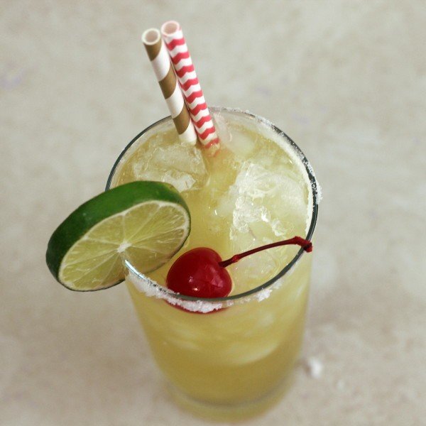 Overhead view of Ambience drink with lime and cherry