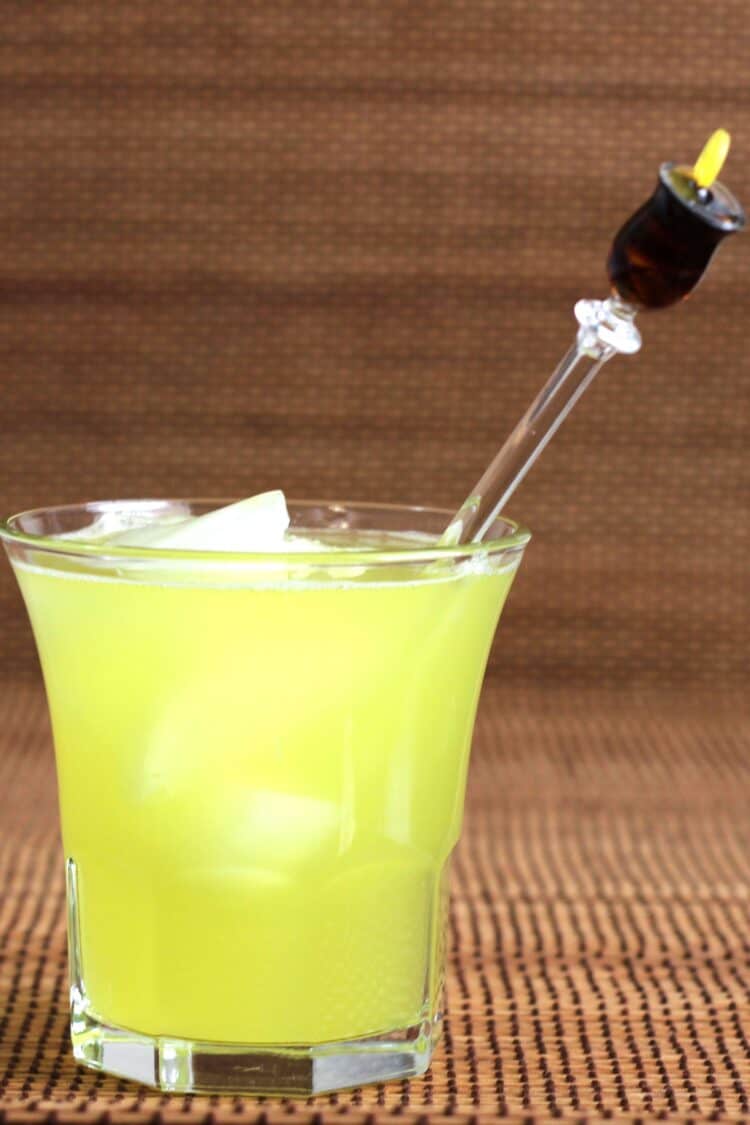 Bright yellow Arcadia Cocktail in rocks glass with ice