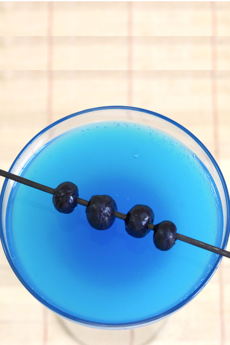 Overhead view of Avartini Cocktail with blueberries