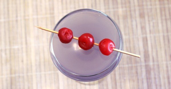 Overhead shot of Aviation cocktail with cherries