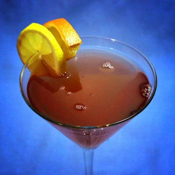 Balm Cocktail with fruit garnish