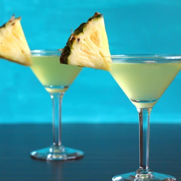 Closeup view of Barbados Cocktail with pineapple wedge