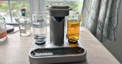 Bartesian cocktail maker machine on table in front of window