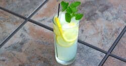 BBQ drink on patio table with mint garnish