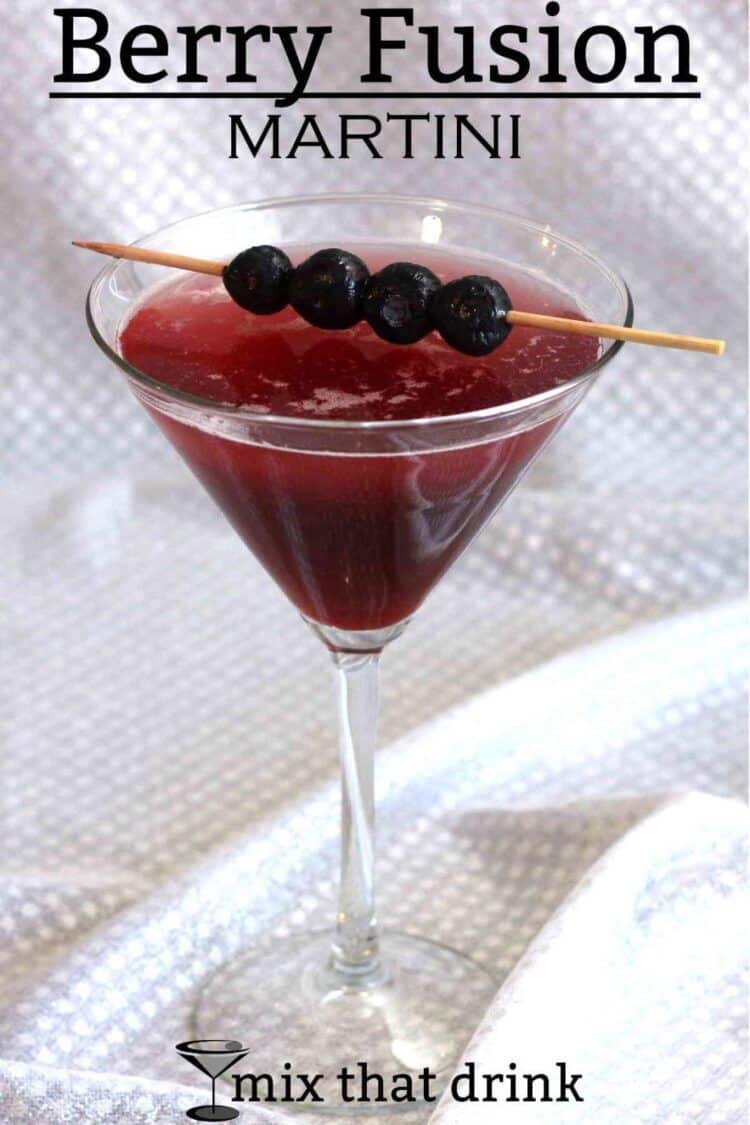 Berry Fusion Martini with blueberries on cocktail pick