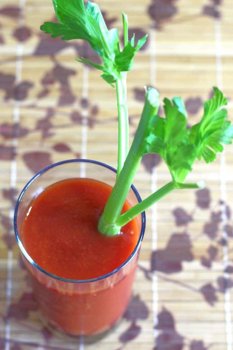 Overhead view of Bloody Mary drink with celery garnish