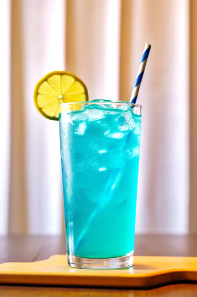 Blue Long Island Iced Tea sitting on coaster on bar