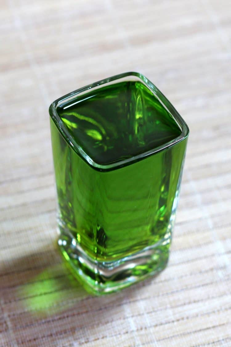 Broken Down Golf Cart in shot glass on table