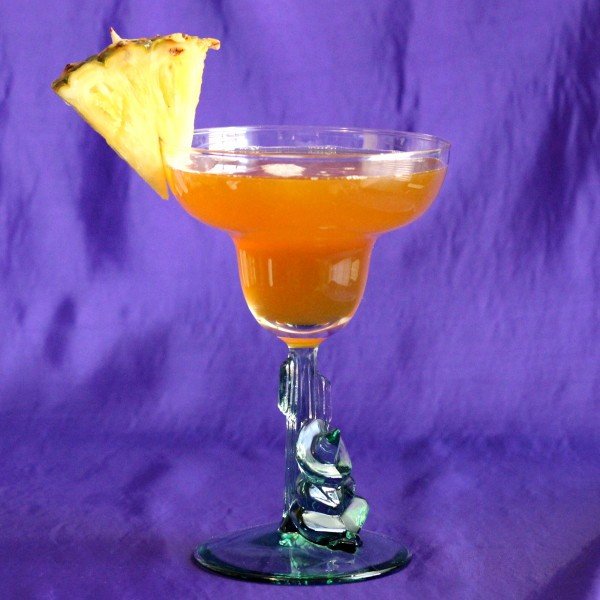 Cactus Bowl drink with pineapple wedge