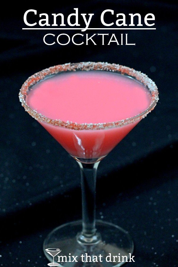 Bright pink Candy Cane Cocktail with candy cane rim