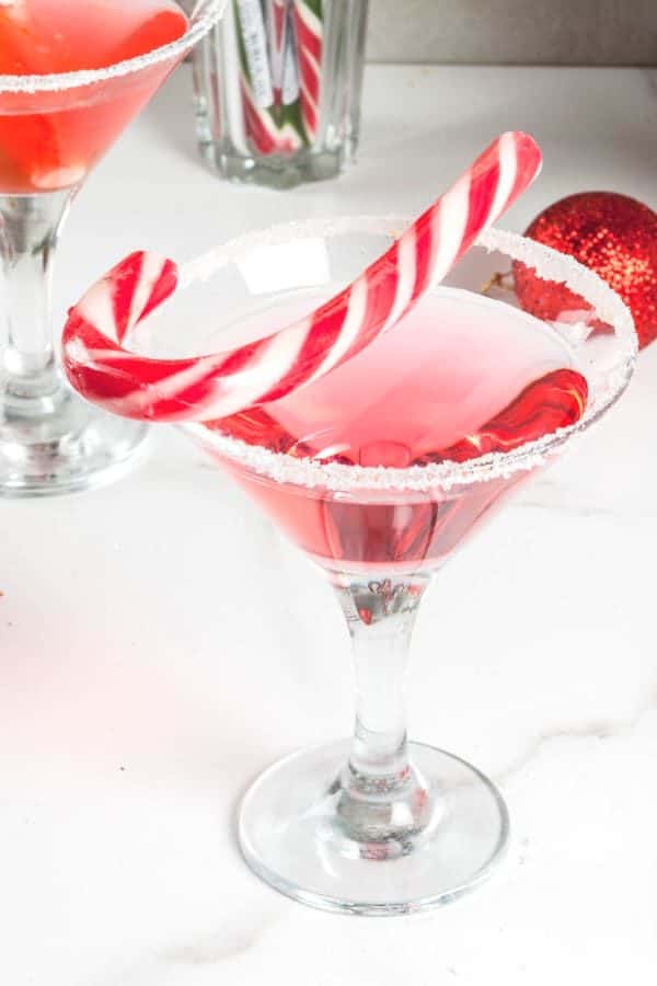 Candy Cane Martini cocktail with candy cane garnish