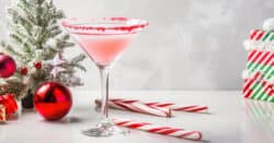 Candy Cane Martini cocktail with candy cane garnish