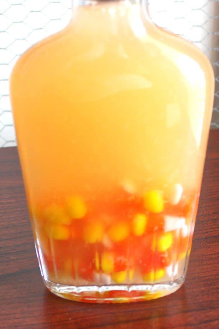 Candy corn turning moonshine yellow inside flask