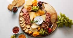 Meat and cheese board for happy hour on table