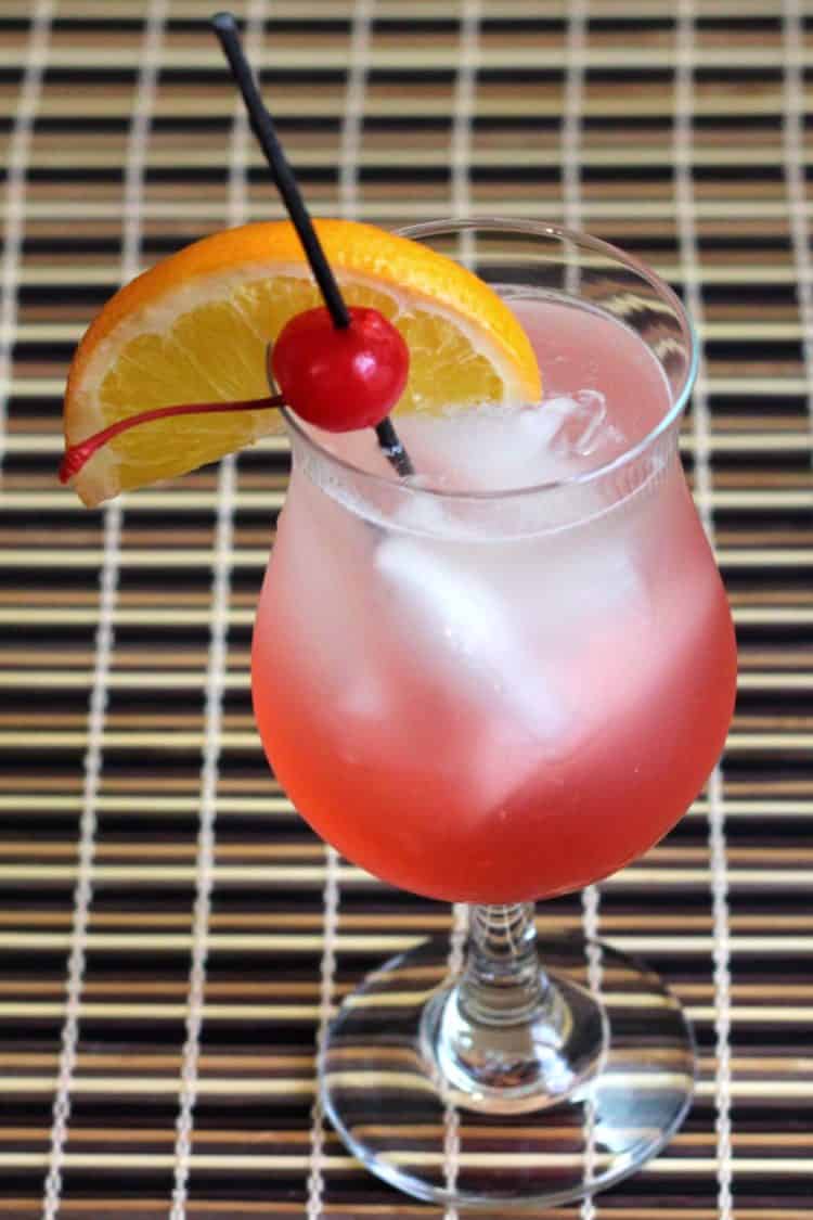 Cherry Vodka Sour drink with orange and cherry