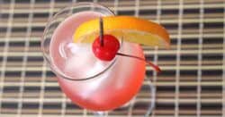 Cherry Vodka Sour drink with orange and cherry