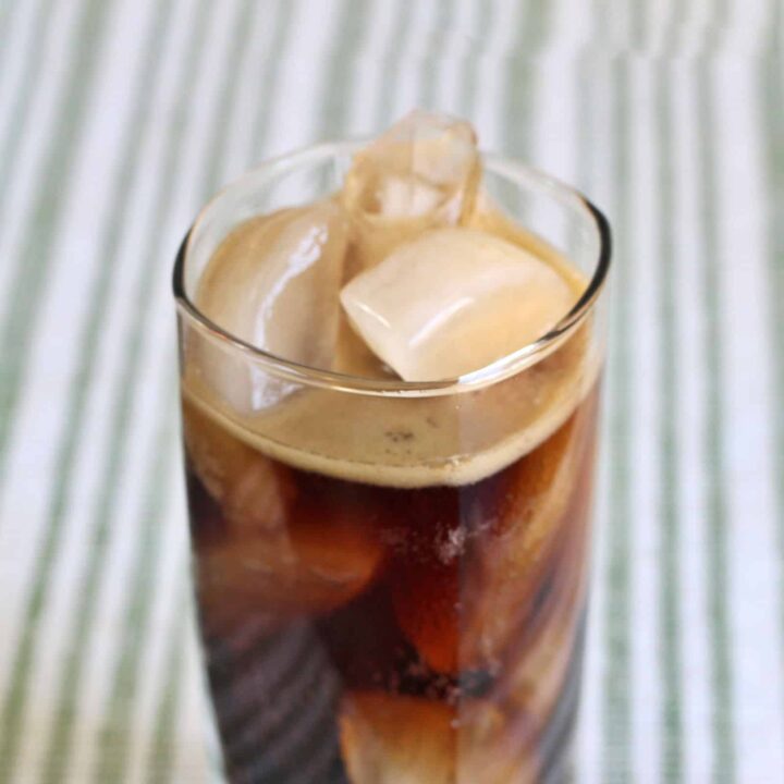 Chocolate Coke cocktail in tall glass with ice