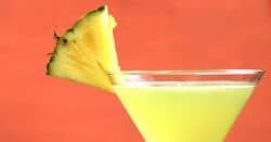 Closeup of Cinco de Mayo drink with pineapple garnish