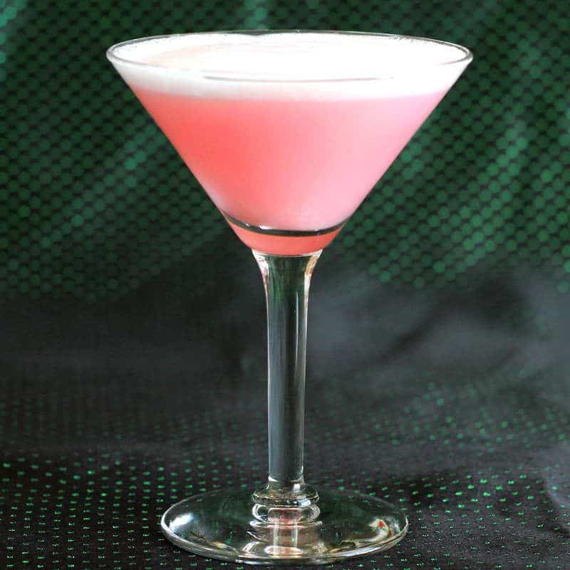 The Clover Leaf cocktail recipe is a very old classic that blends gin with egg white, lime and grenadine. The flavor of this drink is refreshing citrus with a hint of cherry. The egg white adds a creamy, silky texture.