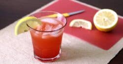 Crystal Cranberry drink with lemons on cutting board