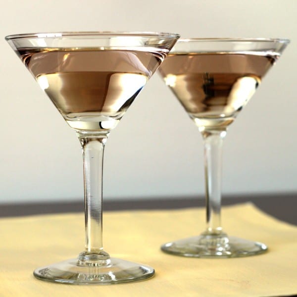 Full-length view of Currant Vodka Martinis on table