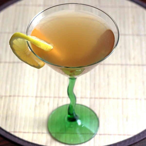 Angled view of Deauville Cocktail with lemon