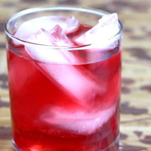 Think of the Desert Shield cocktail recipe as an upgraded Vodka Cranberry. More vodka, plus cranberry liqueur to bring out the sweetness. #desertshield #drinkrecipes #mixthatdrink #vodkacranberry #vodkacocktails #cranberrydrinks