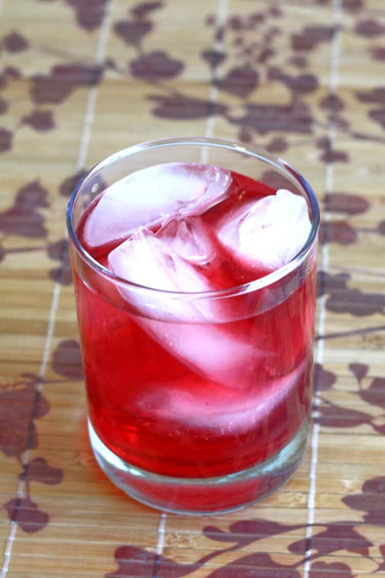 Bright red Desert Shield cocktail on placemat