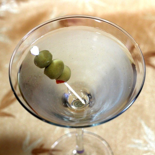 Overhead view of Dirty Martini drink with olives