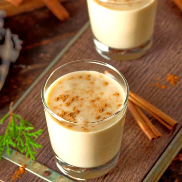 Two glasses of eggnog on table