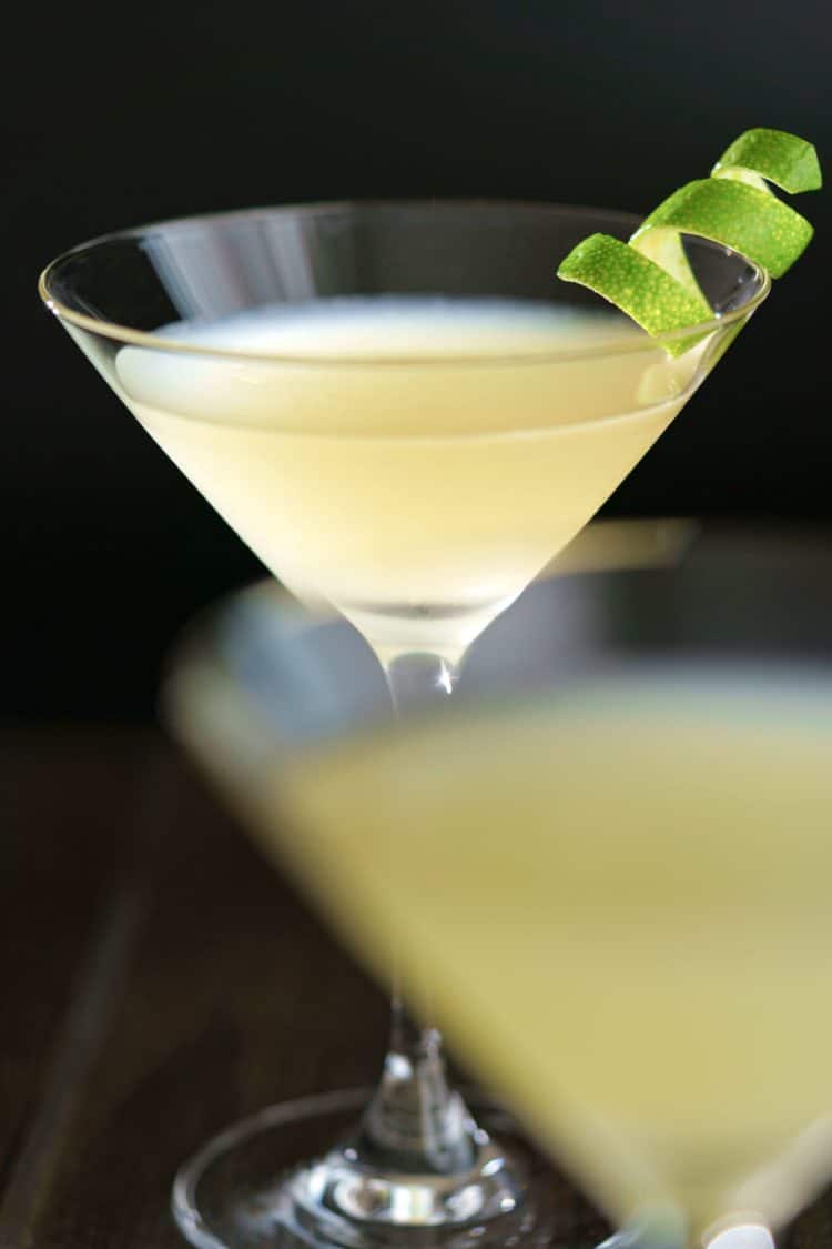 Close up view of Elderflower Martini with lime twist