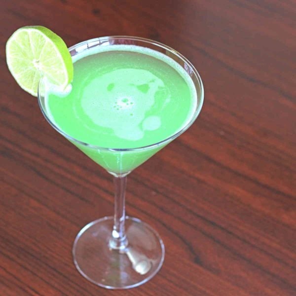 Overhead view of Emerald Rain cocktail with lime