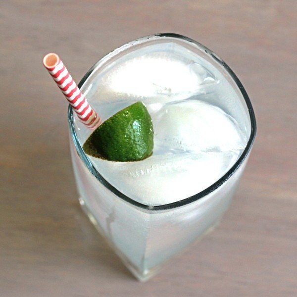 Overhead view of Gin & Tonic classic drink with lime squeeze