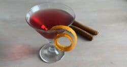 Glogg in the Microwave on table with cinnamon sticks