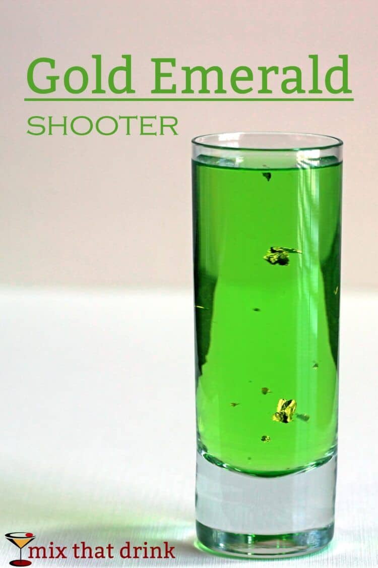 Gold Emerald Shooter drink with gold flecks floating