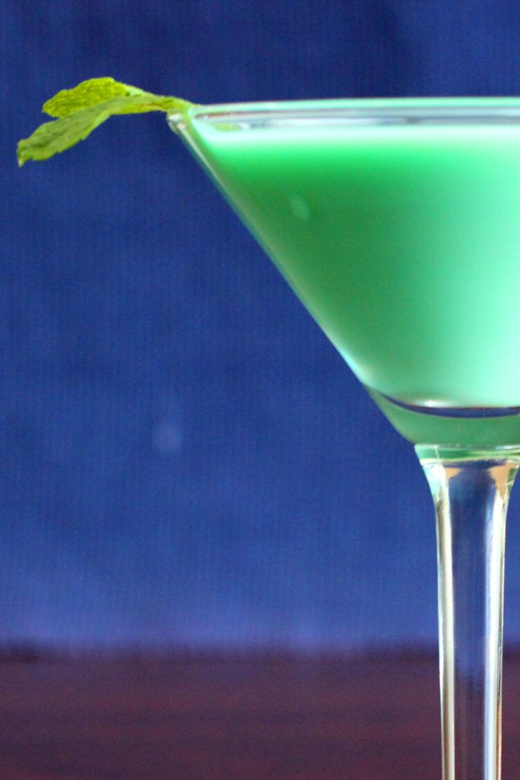 Closeup of creamy green Grasshopper drink with mint sprig