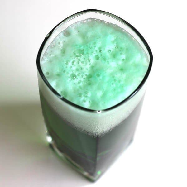 Overhead view of green beer in glass