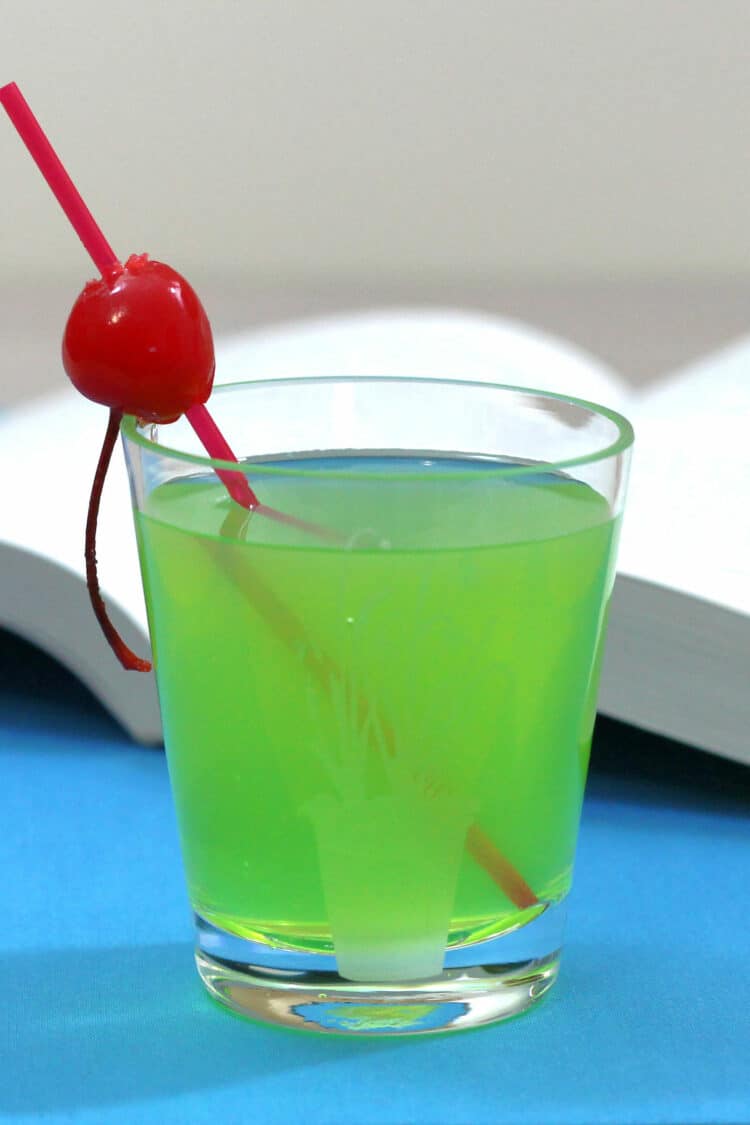 Closeup view of Grinch cocktail with cherry