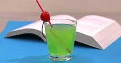 Bright green Grinch cocktail with cherry