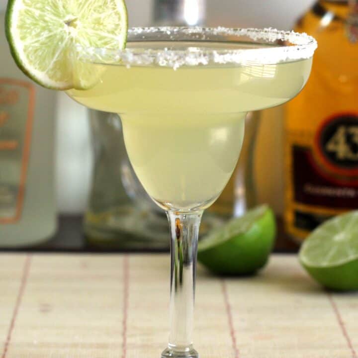 Honey Vanilla Margarita in front of liquor bottles