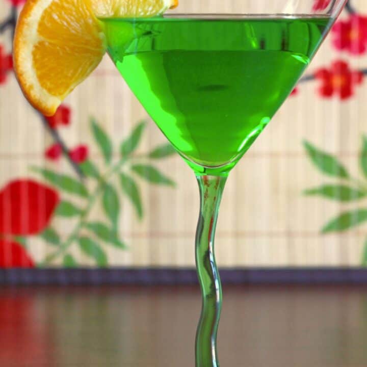 Honeydew Martini drink with orange slice