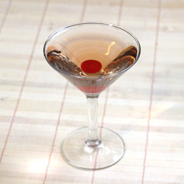 Honolulu Lulu cocktail with cherry on placemat