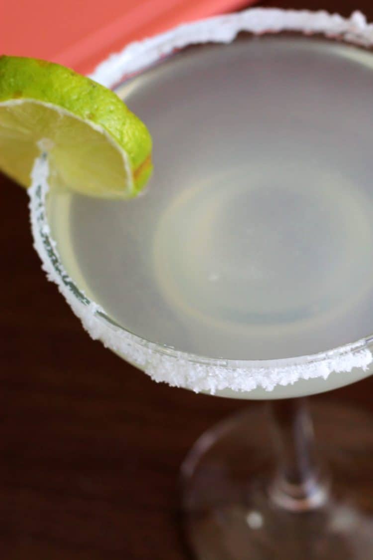 Salt-rimmed margarita with lime