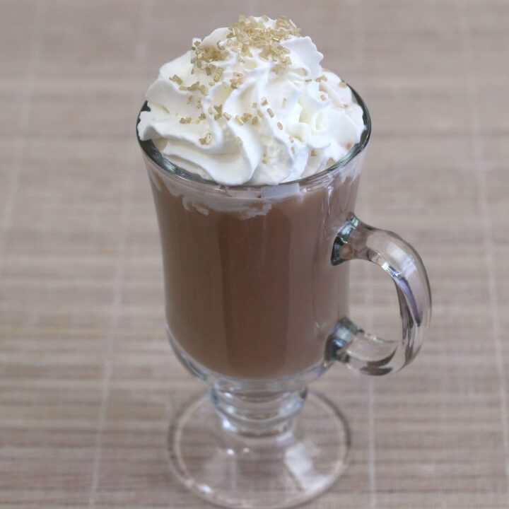 Irish Coffee drink with whipped cream and sprinkle