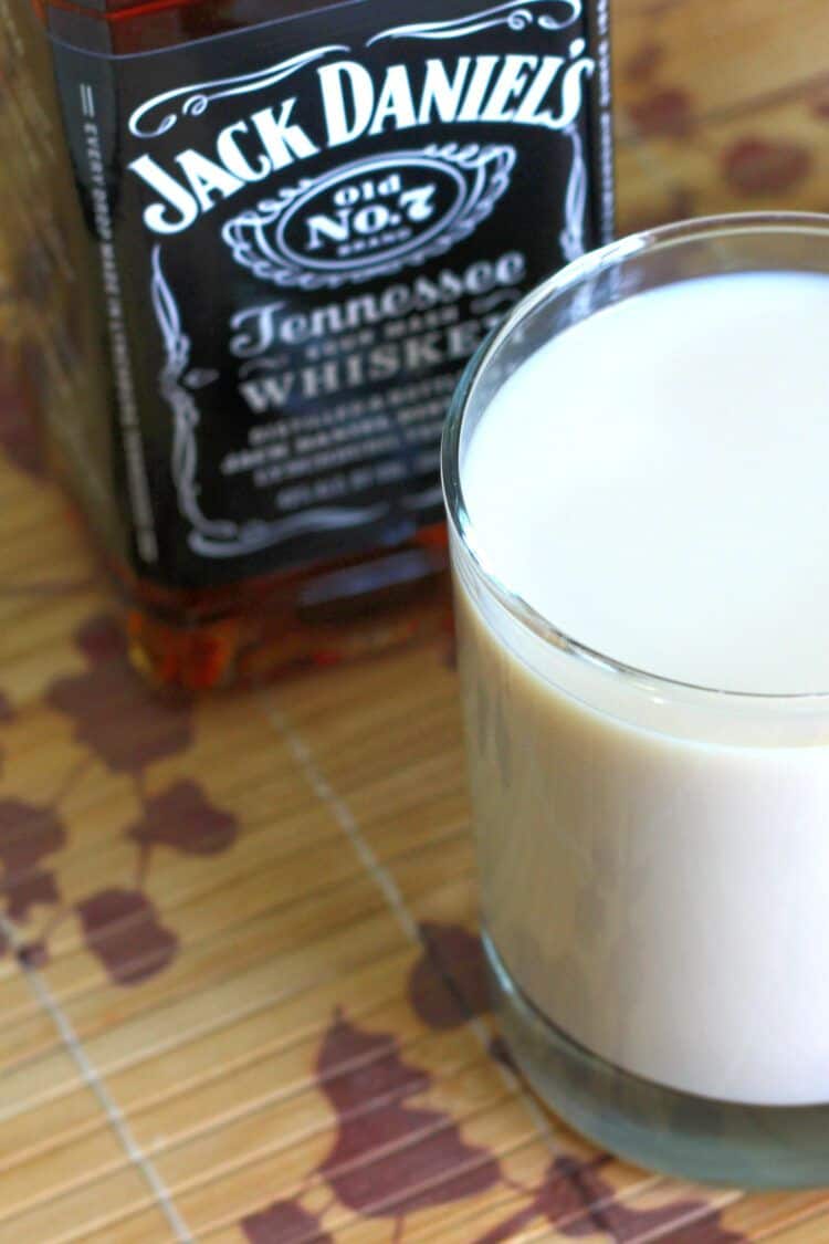 Bottle of Jack Daniels behind cocktail