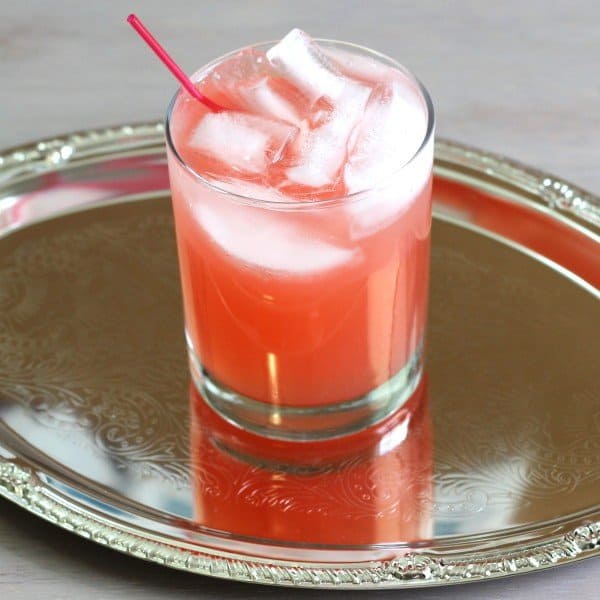 Overhead view of Jack Honey & Grapefruit drink on silver serving tray