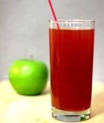 Jack's Apple drink beside green apple